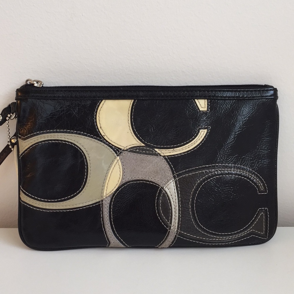 COACH Black & White Leather wristlet. 5x8”